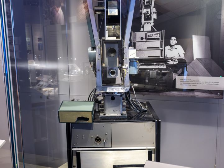 Shakey, a tall wheeled robot with a camera head, on display at the Computer History Museum